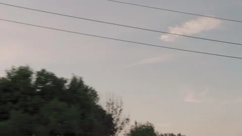 View from window of high-speed train on landscape of beautiful nature wild field Stock Footage 161841302