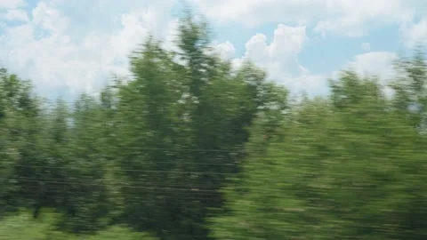 View from window of high-speed train on landscape of beautiful nature wild field Stock Footage 162423040