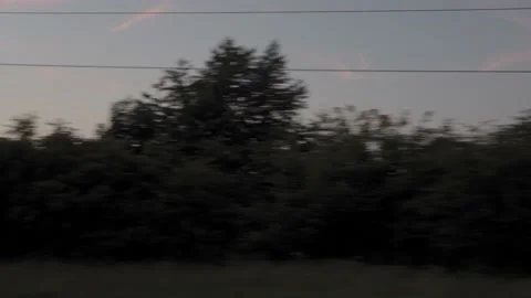 View from window of high-speed train on landscape of beautiful nature wild field Stock Footage 166026564