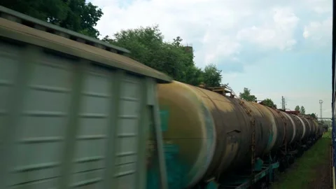 View from window high-speed train on old abandoned station and rusty freight Stock Footage 167324324