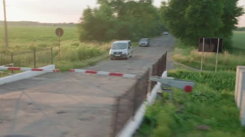 View from window high-speed train on landscape of nature field road with car on Stock Footage 221873772