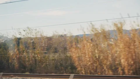 View from the window of a high-speed train. View of the locality to the city. Stock Footage 310602063