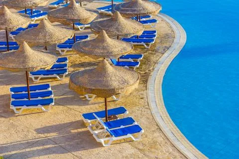 The view from the window of the hotel in Egypt to the pool, sun umbrellas a.. Stock Photos