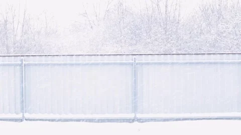 View from the window on how hard it snows. Snowfall outside the city. Video stock 240304522