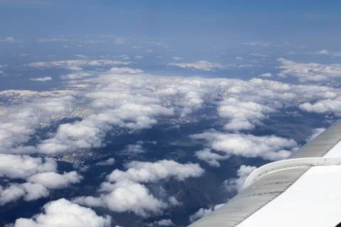 View from window of a jet plane wing with beautiful weather Stock Photos