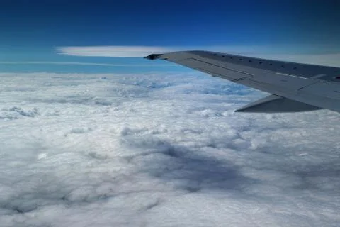 View from window of a jet plane wing with beautiful weather Stock Photos