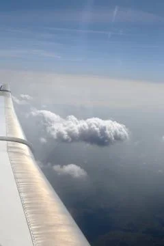 View from window of a jet plane wing with beautiful weather Stock Photos