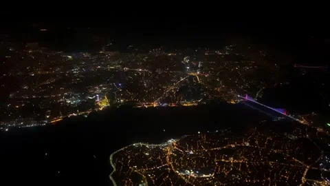 View from window of landing plane night city of Istanbul illumination of light Video stock 262606195
