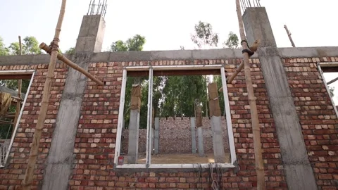 View of Window of Large Building Under Construction In India Lens Flare 스톡 동영상 267437964