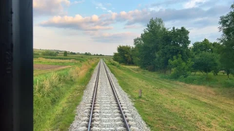 A view from the window of the last carriage of a passing train. Stock Footage 318976217