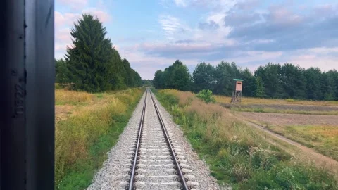 A view from the window of the last carriage of a passing train. Stock Footage 318976900
