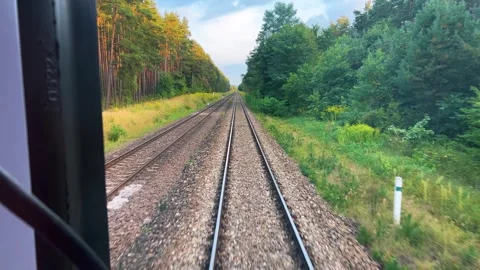 A view from the window of the last carriage of a passing train. 動画素材 318977422