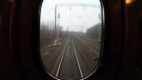 View from window of last moving train carriage or waggon, sleepers and rails Stock Footage 84330621