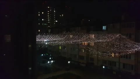 View from the window on a million lights of a holiday garland in the big city Stock Footage 163114239
