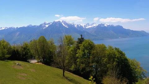 View from Window of Mountain Train on Lake Geneva, Swiss Houses and Alps in Stock Footage 116585755