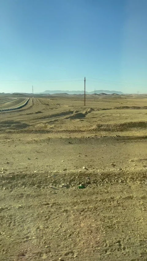 View from the window of a moving bus on the desert in Egypt Stock Footage 169997303