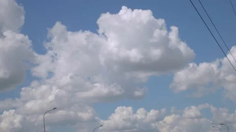 View from the window of a moving car on the blue sky, road lights and road signs Stock-Footage 138303642