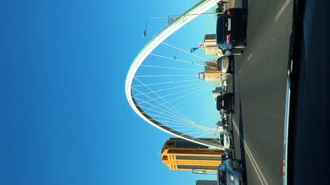 View from the window of a moving car on the Ramstore arch bridge over the river Stock Footage 113673227