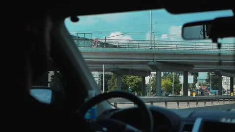 View from the window of a moving car on the road through the city Stock Footage 169518443