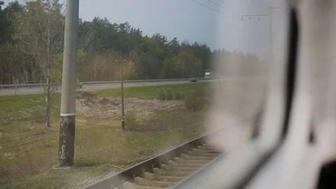 View from the window of moving train. Green nature, sunny day in the view. Stock Footage 81267162