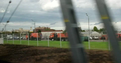View from the window of a moving train on the outskirts of a big city Stock Footage 67469314