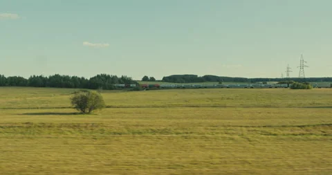 View from the window of a moving train. Rural landscape with private houses. Stock Footage 165421374