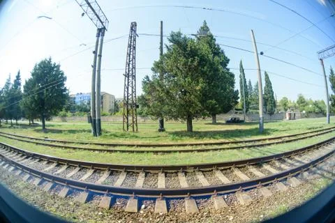 A view from a window of a moving train shot on a wide-angle lens. Stock Photos