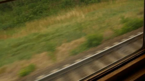 View from a window from a moving train in summer Stock Footage 113742840
