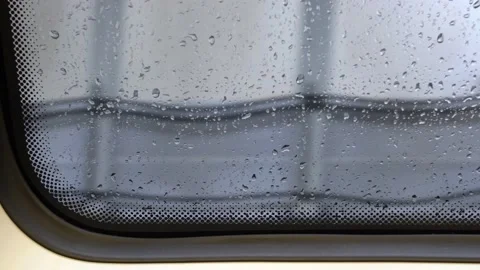 The view from the window of the MRT train on a rainy day. Video stock 160192437