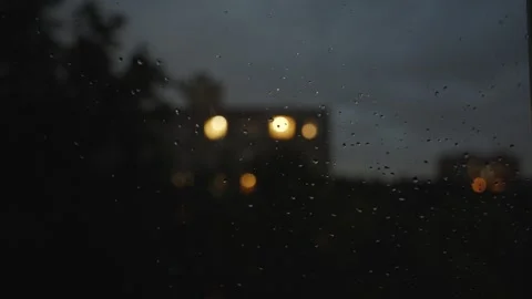 View from the window at night during rain and lightning. Raindrops on the window Stock Footage 337073218