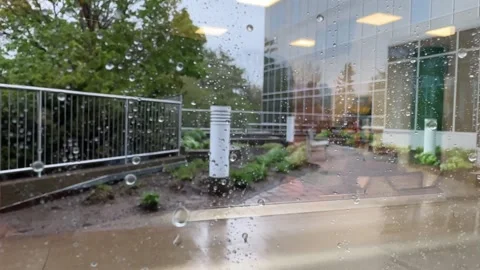 View from window an office building on a storm and rain in courtyard skyscraper. Stock Footage 277420665