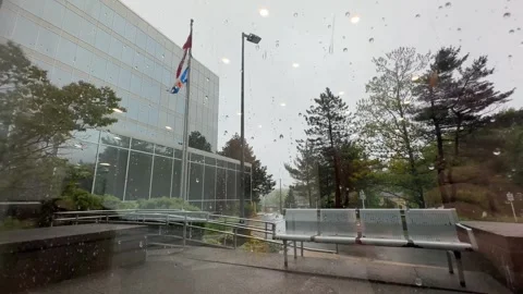 View from window an office building on a storm and rain in courtyard skyscraper. Stock Footage 277420998