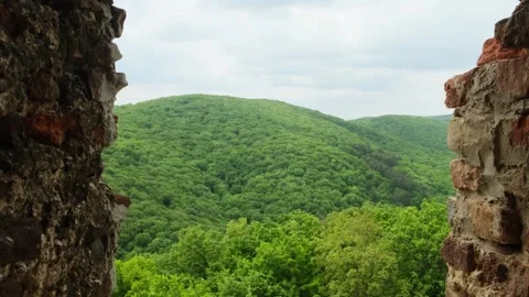 View from the window of the old brick fortress on the mountain landscape. Stock Footage 241708658
