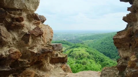 View from the window of the old brick fortress on the mountain landscape. Stockbeeldmateriaal 241878105