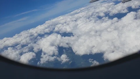 View from the window of a passenger plane on a huge wall of clouds. Stock-Footage 122360193