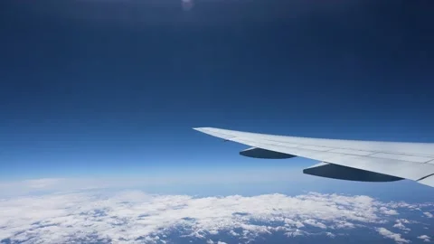 View from a window plane on Atlantic Ocean and mountains Stock Footage 194353424