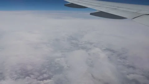 View from a window plane on clouds Stock Footage 194353422