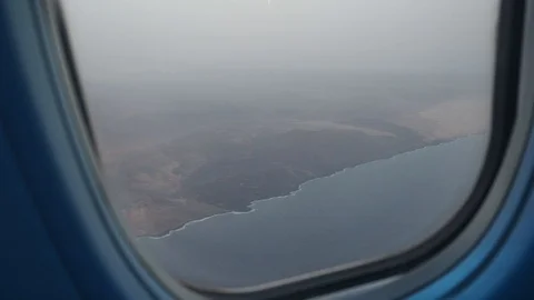 View from the window of the plane from the coast Stock Footage 102230778