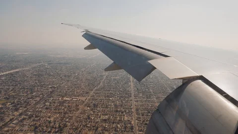 View From Window Of Plane Coming In To Land In Los Angeles On Blocks And Houses Stock Footage 126088012