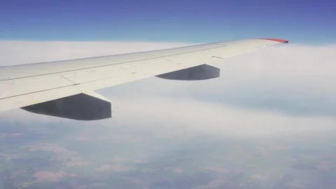 View from the window of the plane. Flight over the ground. Stock Footage 89779157