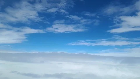 View from the window of the plane on the white clouds, the flight between the 動画素材 99763336