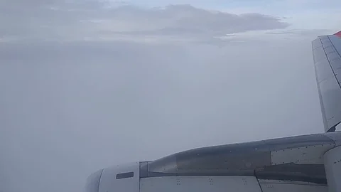 View from the window of the plane at the white clouds in the sky Video stock 123283458