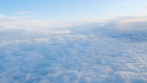 View from the window of the plane at the white clouds in the sky Video stock 125337161