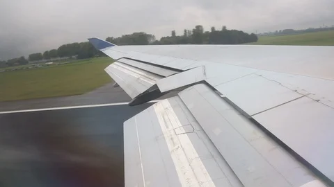 View From Window Of Plane Wing During Takeoff Cloudy Left to Right Stock-Footage 102502915