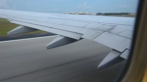 View From Window Of Plane Wing During Takeoff Left to Right Video stock 102503118