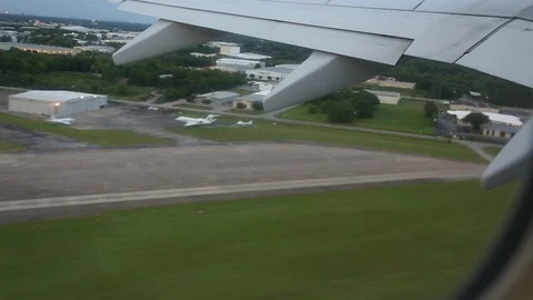 View From Window Of Plane Wing During Takeoff Left to Right Dusk Stock Footage 102503137