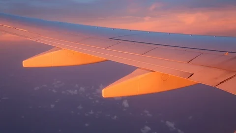 View From Window Of Plane Wing Lit By Golden Sunset Stock-Footage 102503277