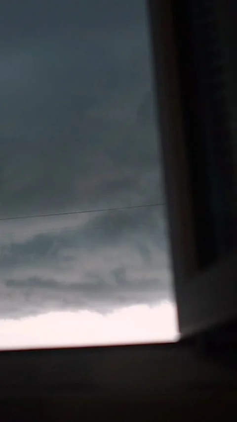 View from the window with rain clouds and lightning, sky timelapse Stock Footage 303345471