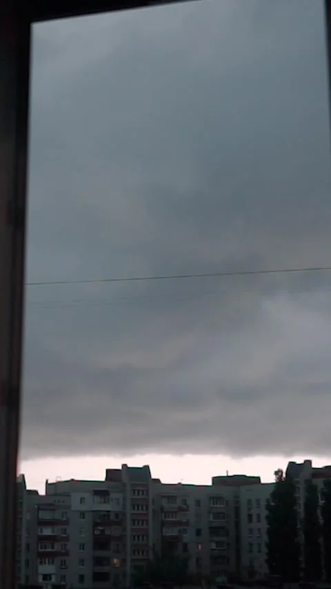 View from the window with rain clouds and lightning, sky timelapse Stock Footage 303345565