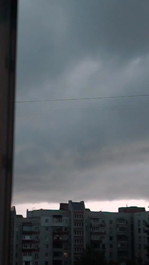 View from the window with rain clouds and lightning, sky timelapse Stock Footage 303345638